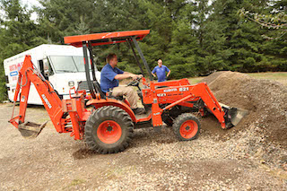 Petersen Plumbing's backhoe on a job.