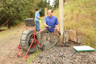 Petersen Plumbing locating an underground drain pipe.