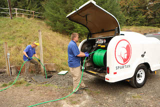 Petersen Plumbing jetting a drain.